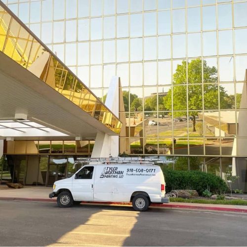 Commercial building exterior with painting company van