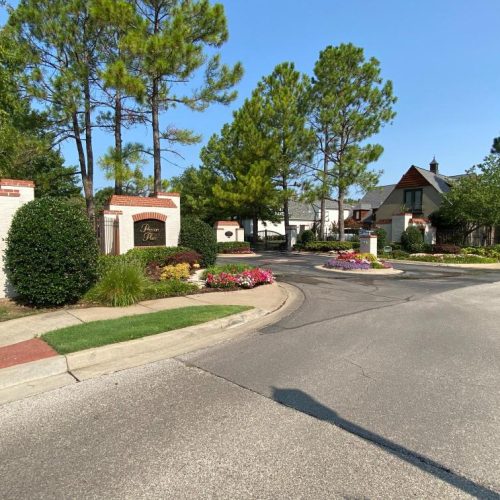 Landscaped neighborhood entrance sign and roadway